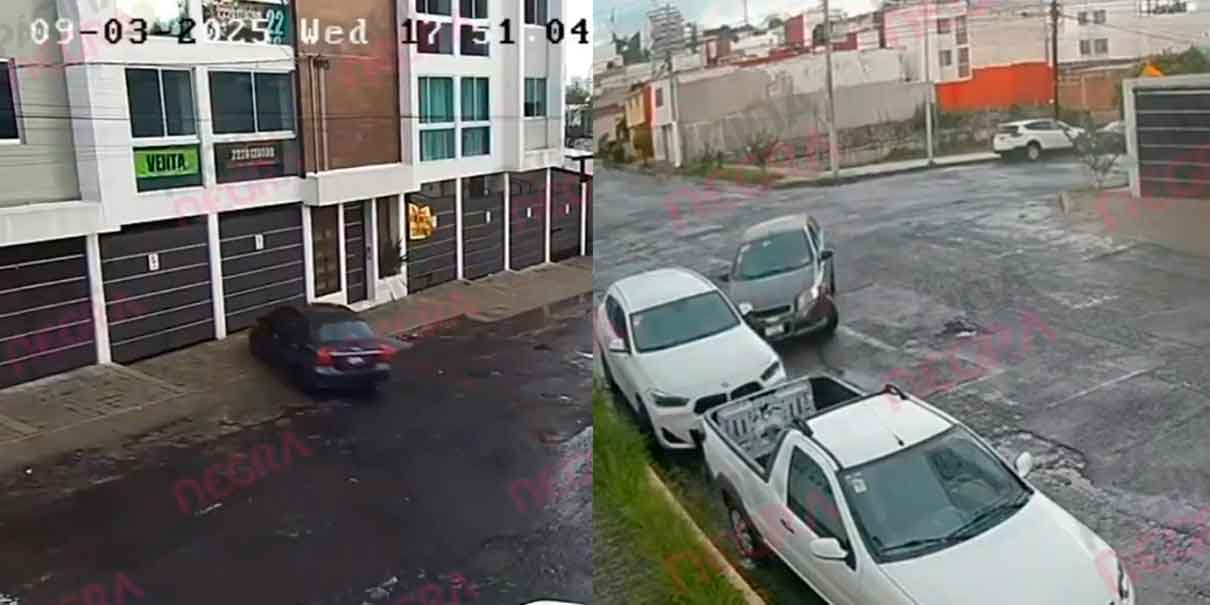 VIDEO. Conductor choca contra auto y derriba portón de cochera en Puebla