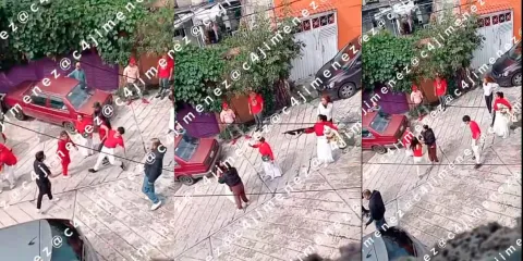 VIDEO. Mujer amenaza con arma larga mientras carga a un bebé durante riña en Naucalpan