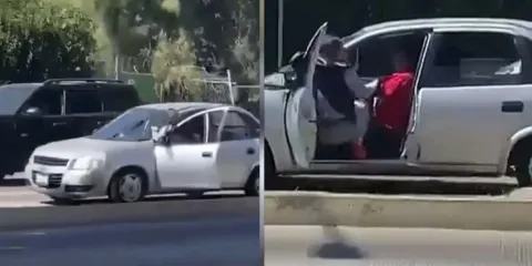 Mujer se aferra a su auto en movimiento para frustrar robo en Puebla
